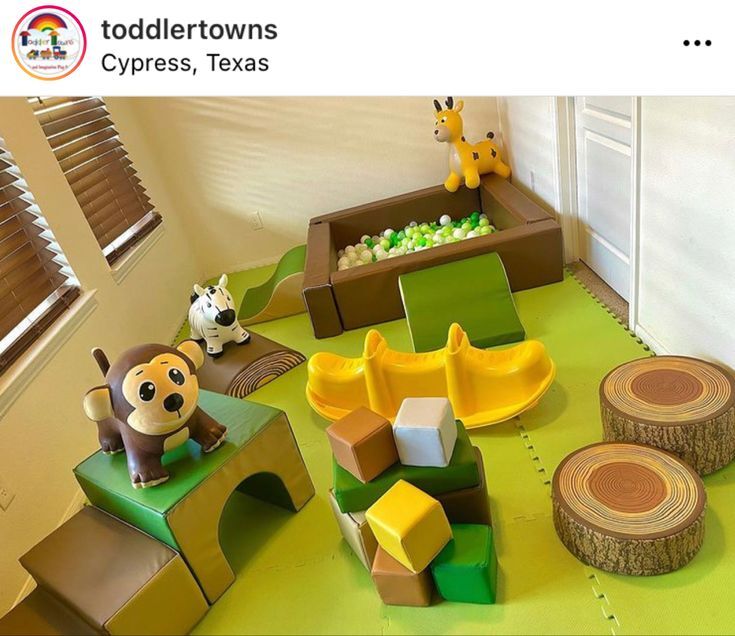 Safari themed indoor soft play rental with foam blocks, ball pit and slide set up in a living room